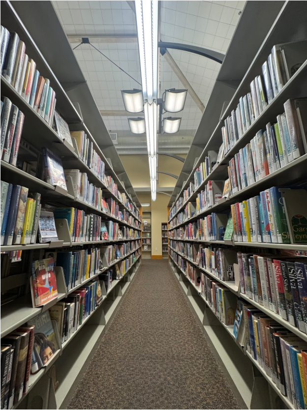 Inside bookshelves of the Rohnert Park Library, an excellent environment for focusing on your finals (Photo: Kareem Shamma).